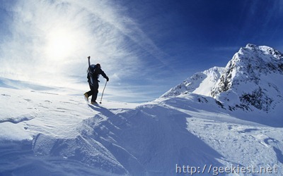 Skier hiking to summit